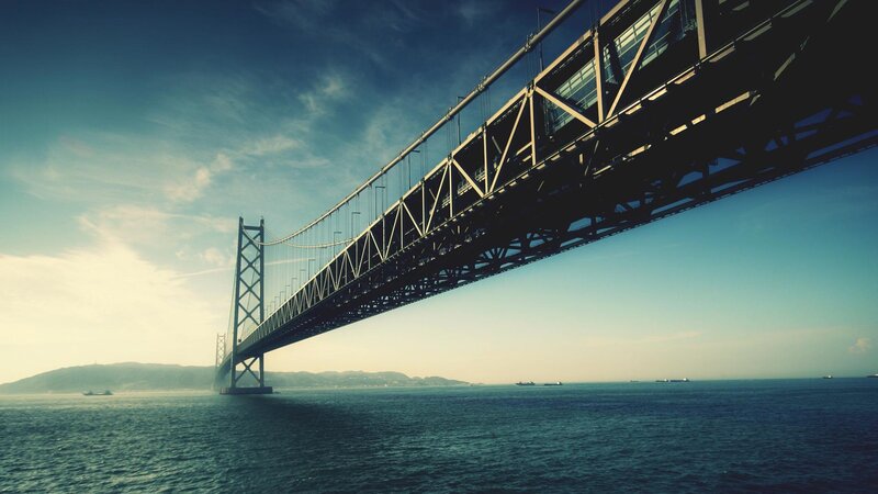 Suspension Bridge over Water — Blue, Dramatic, Afternoon, Photograph, Sea, Sky, Mountains