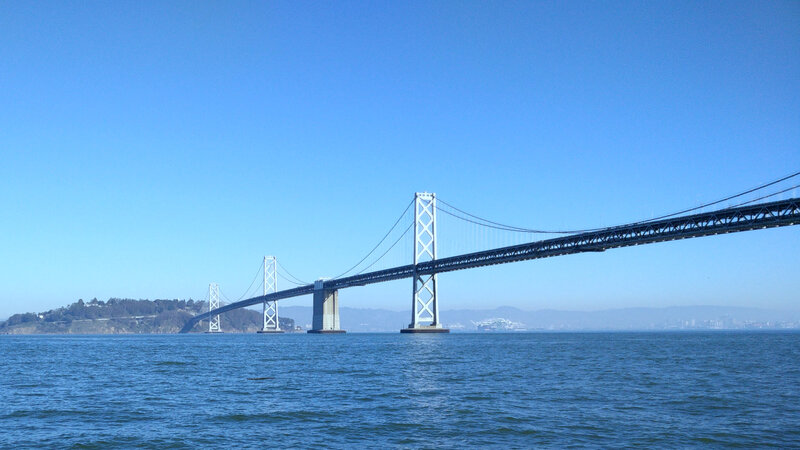 Suspension Bridge over Water — Blue, Serene, Afternoon, Photograph, Sky