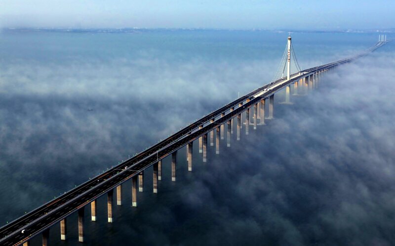 Suspension Bridge over Water — Blue, Serene, Morning
