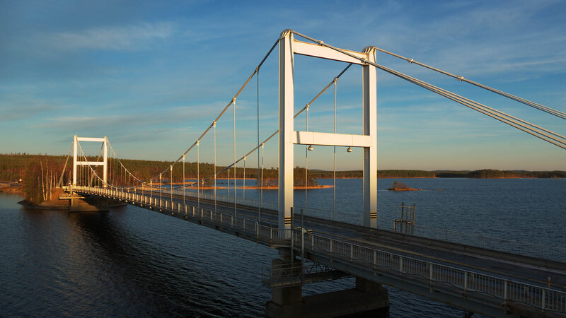 Suspension Bridge over Water — Blue, Serene, Sunset