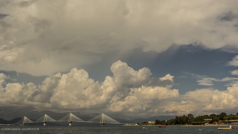Suspension Bridge over Water — Gray, Dramatic, Afternoon