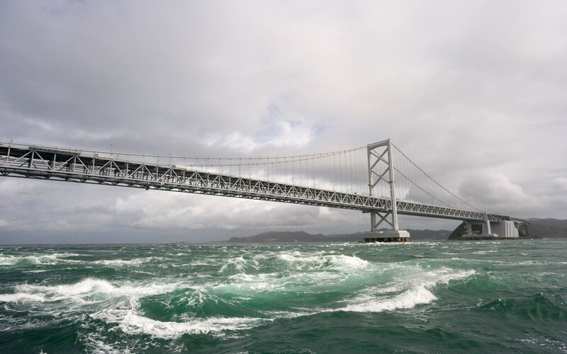 Suspension Bridge over Water — Gray, Dramatic, Photograph, Ocean
