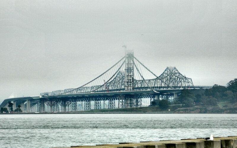 Suspension Bridge over Water — Gray, Overcast