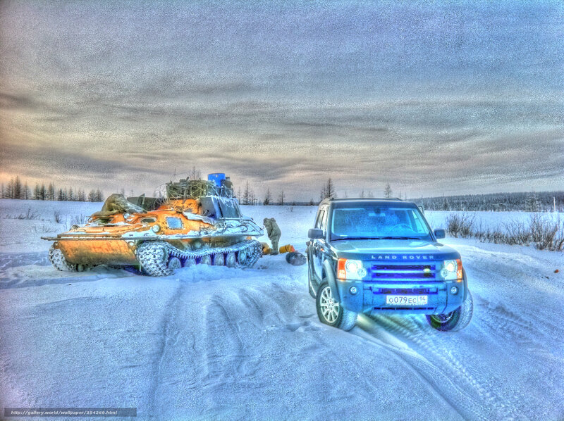 SUV and tank in snowy landscape