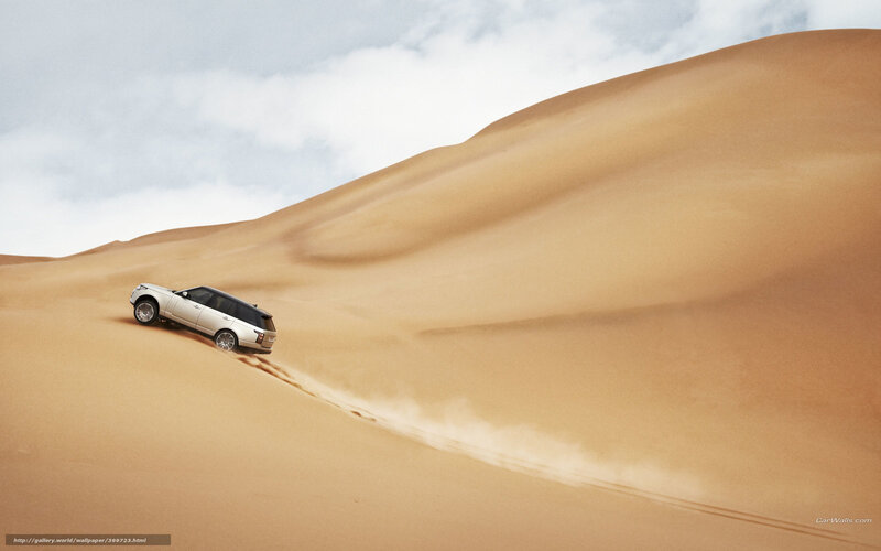 SUV climbing sand dune