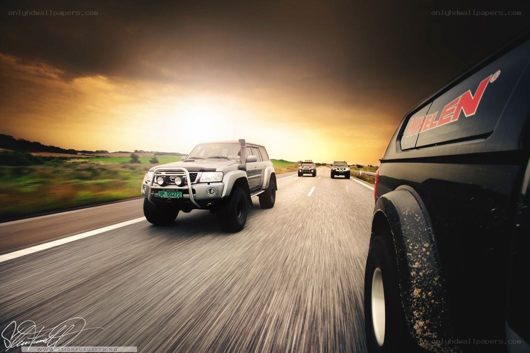 SUV convoy on a road