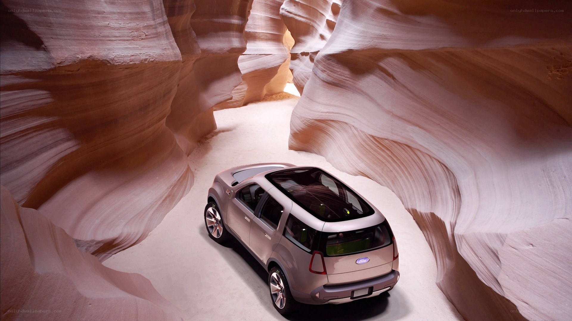 SUV in a sandstone canyon