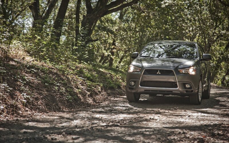 SUV on a forest path