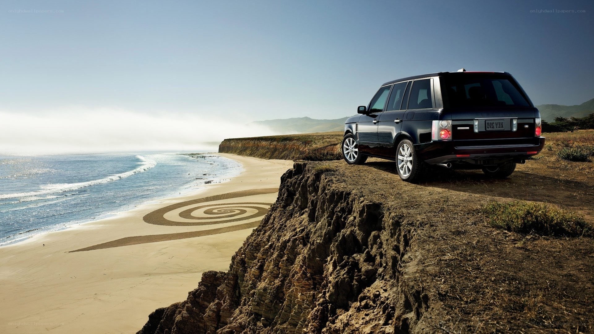 SUV on coastal cliff