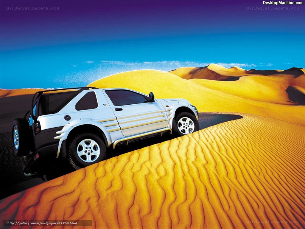 SUV on desert dunes