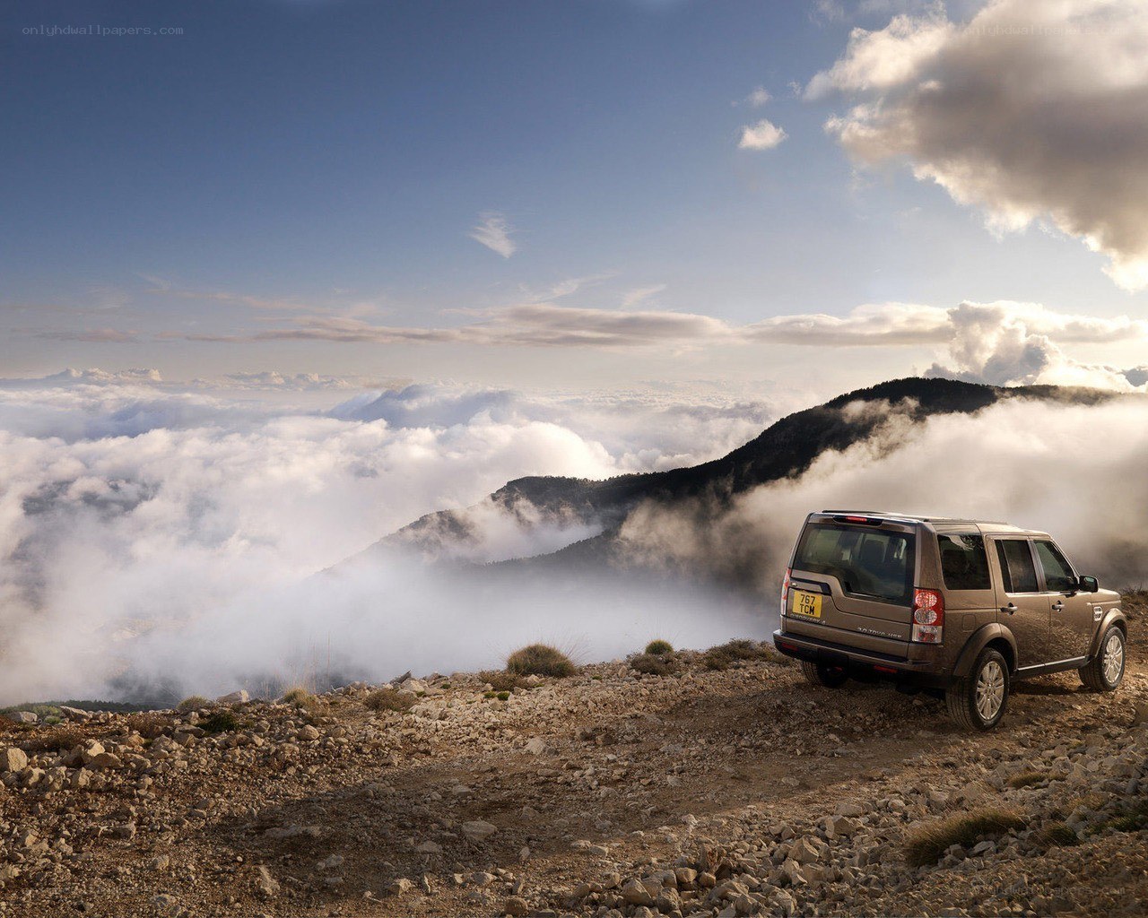SUV on mountain overlook