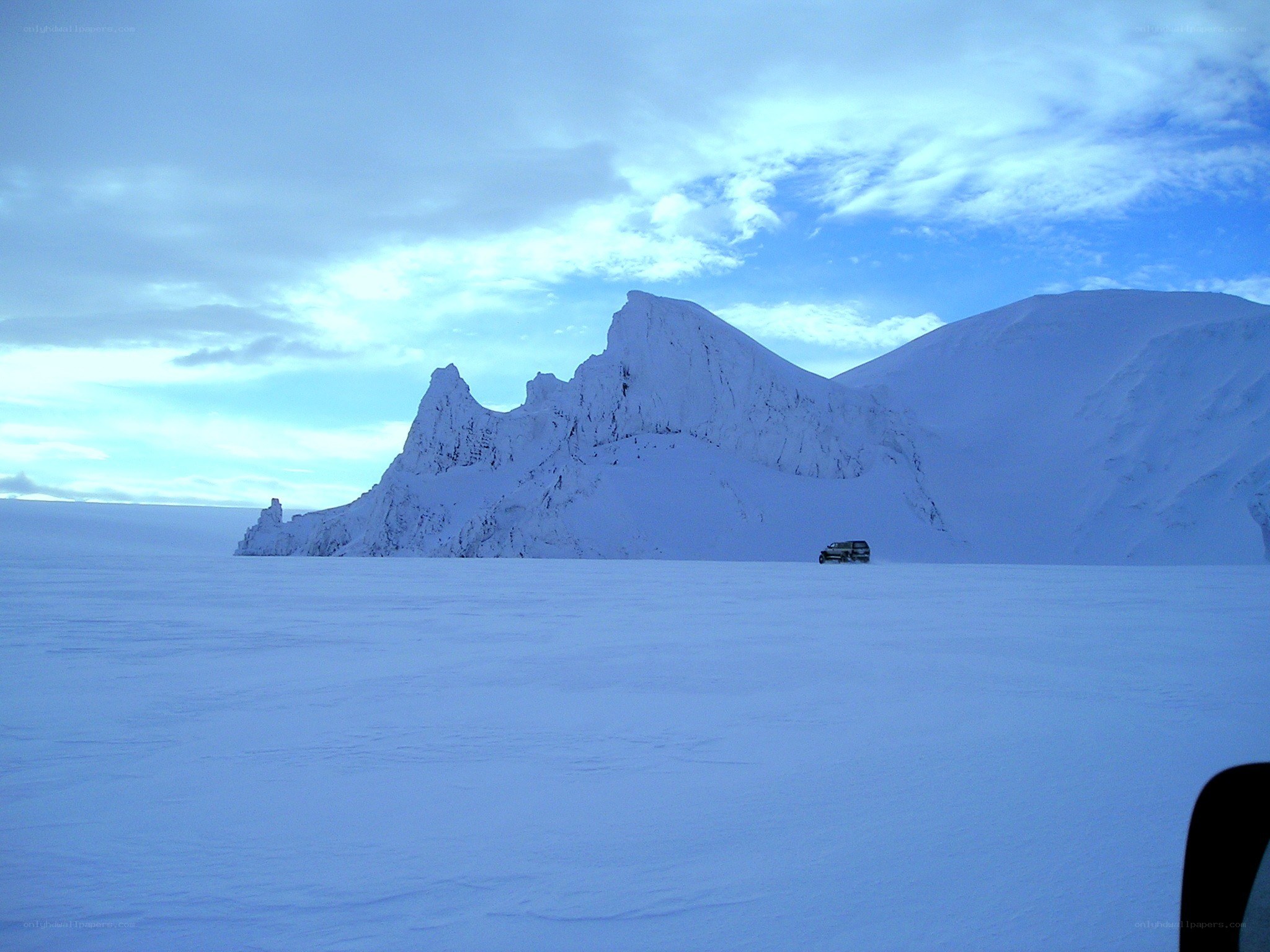 SUV on snowy plain