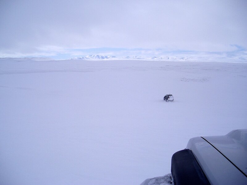 SUV on snowy plain