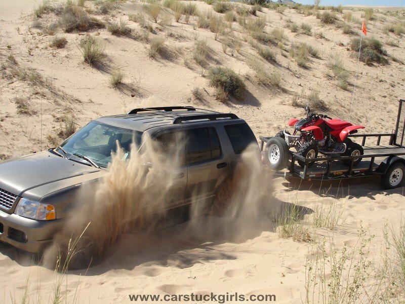 Suv Pulling Trailer in Desert