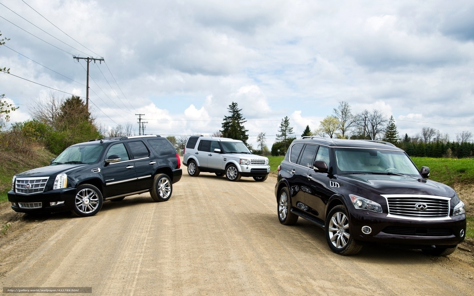 SUVs on a dirt road