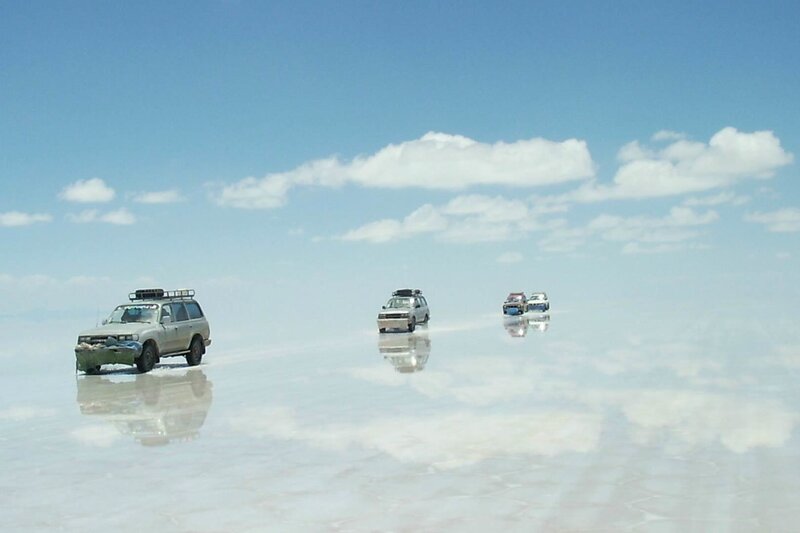 SUVs on a salt flat