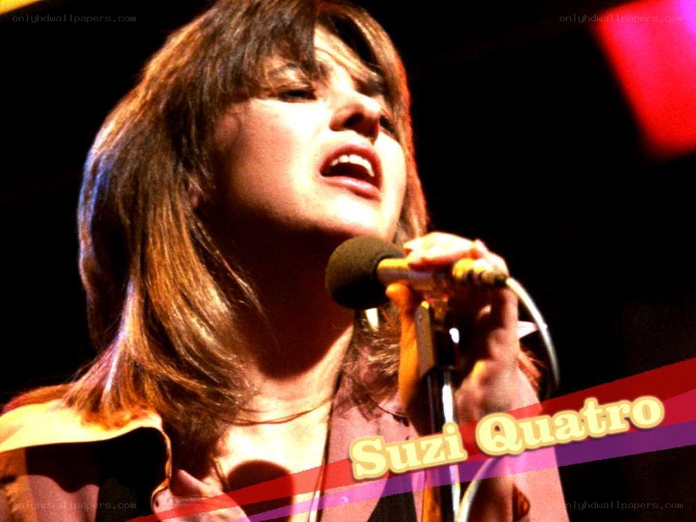 Suzi Quatro singing on stage