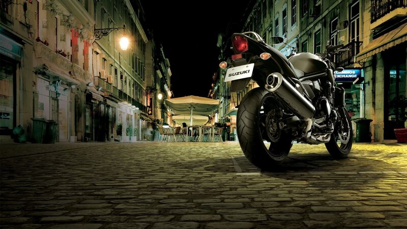 Suzuki motorcycle on cobblestone street