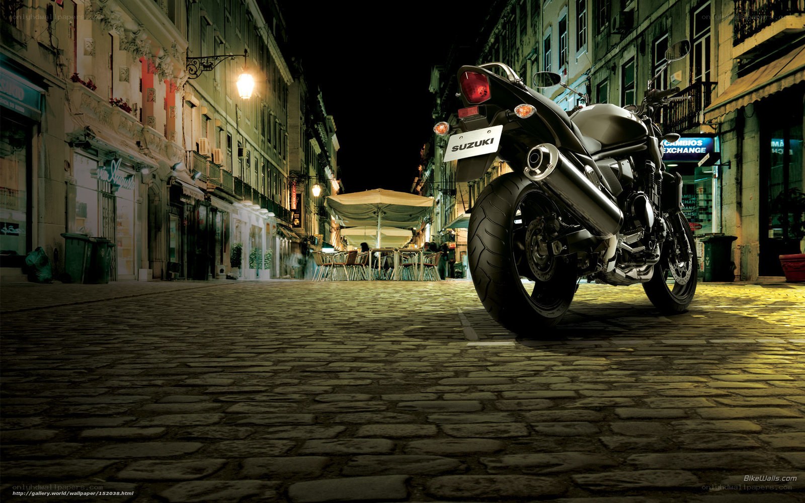 Suzuki motorcycle on cobblestone street