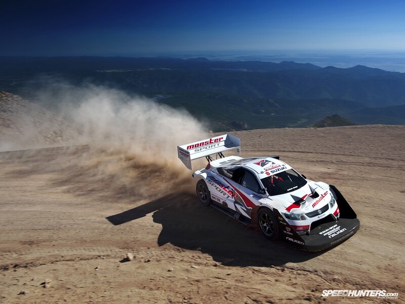 Suzuki rally car on dusty mountain