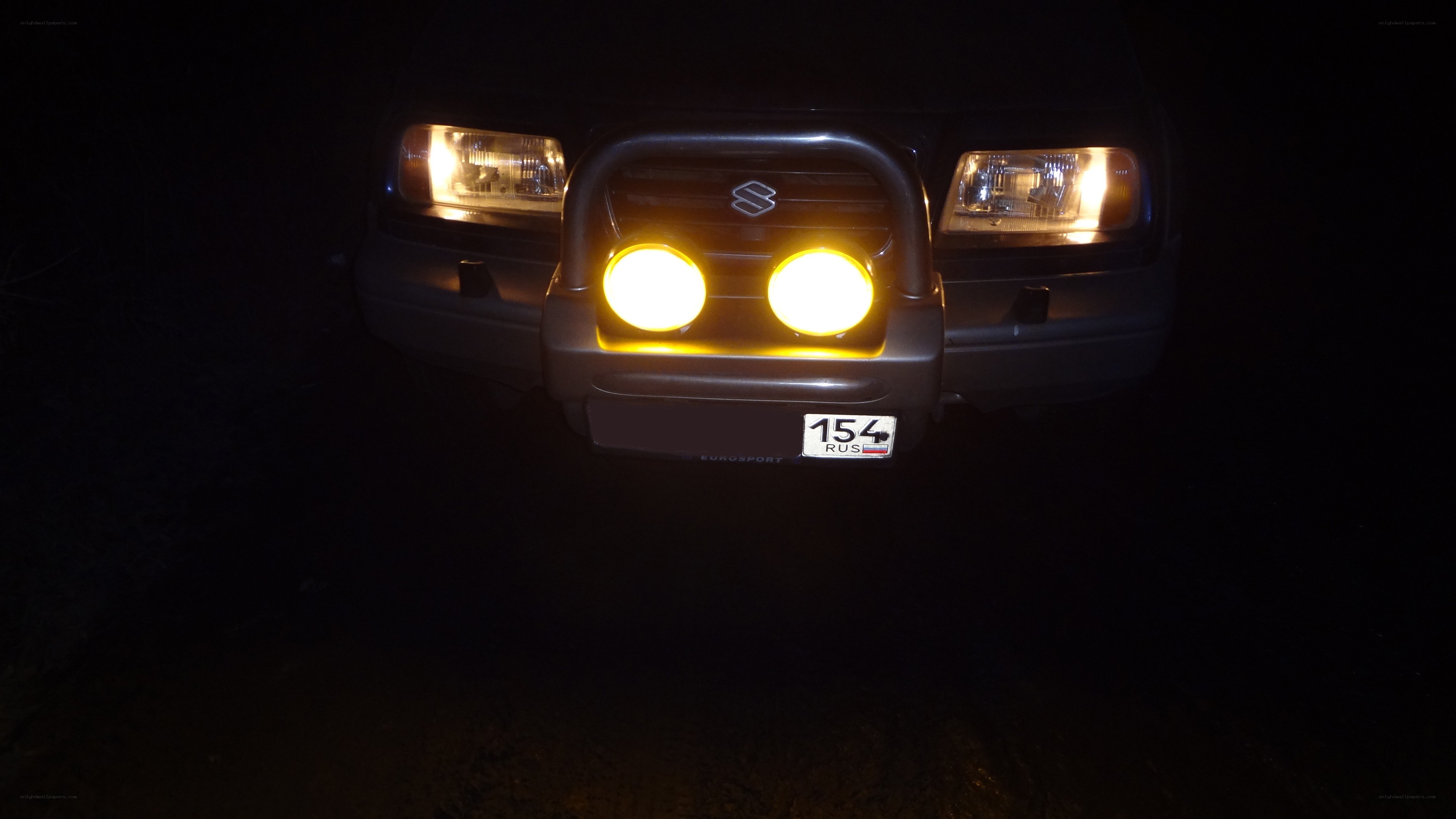 Suzuki vehicle at night