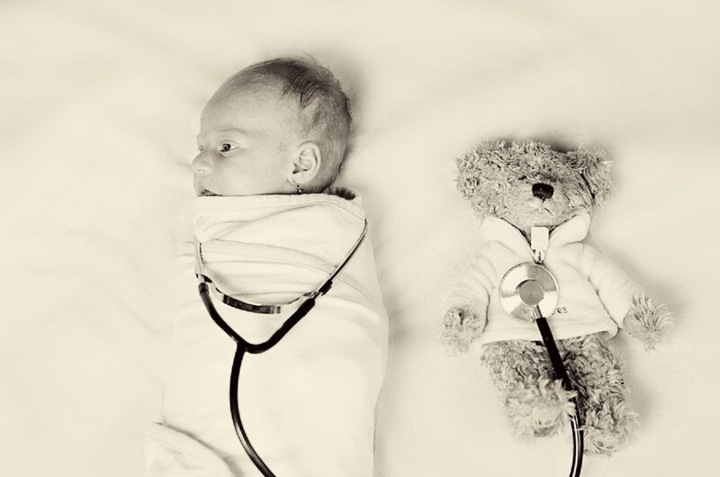 Swaddled Baby and Teddy Bear