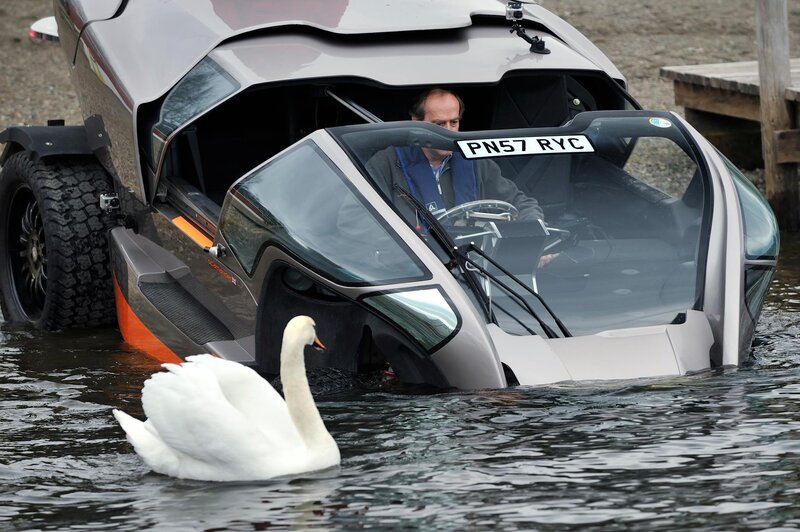 Swan near amphibious car