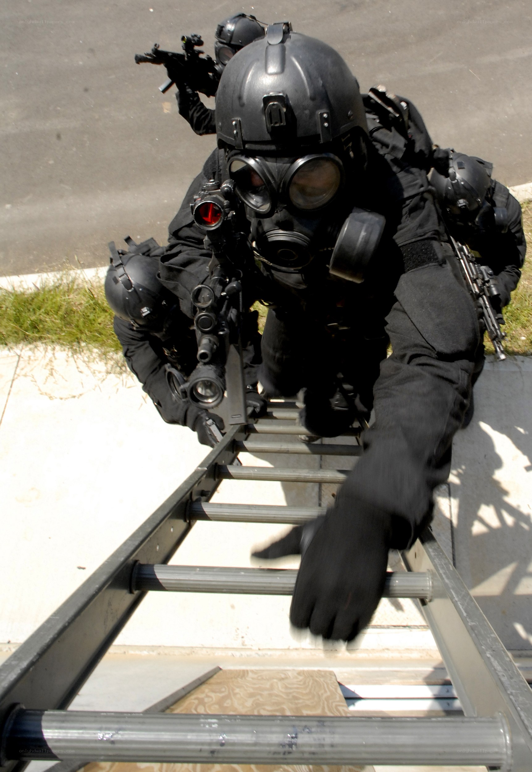 SWAT team climbing ladder