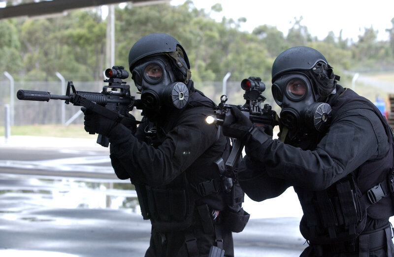 SWAT team in gas masks