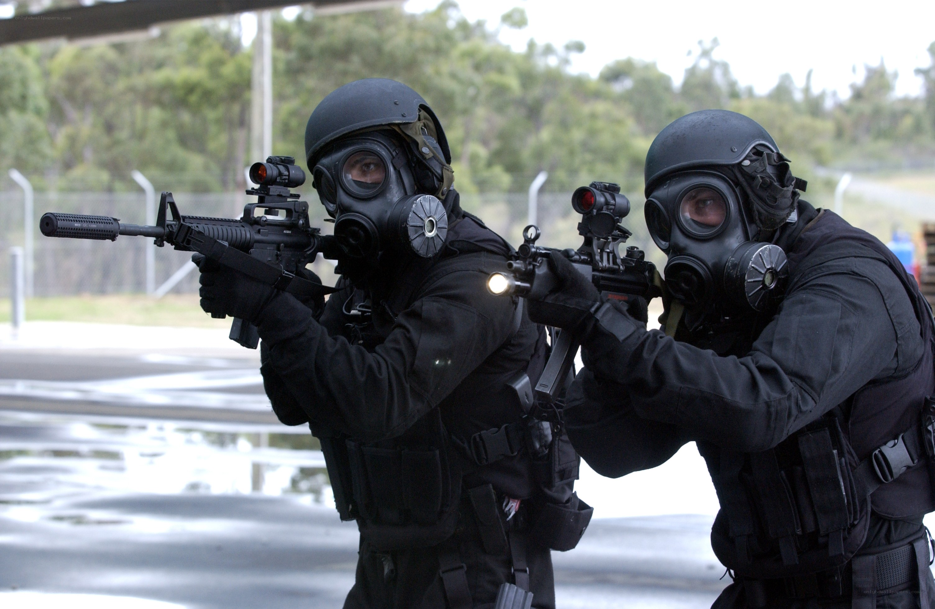SWAT team in gas masks