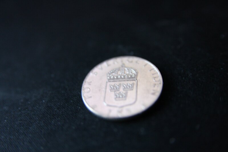 Swedish coin on black fabric