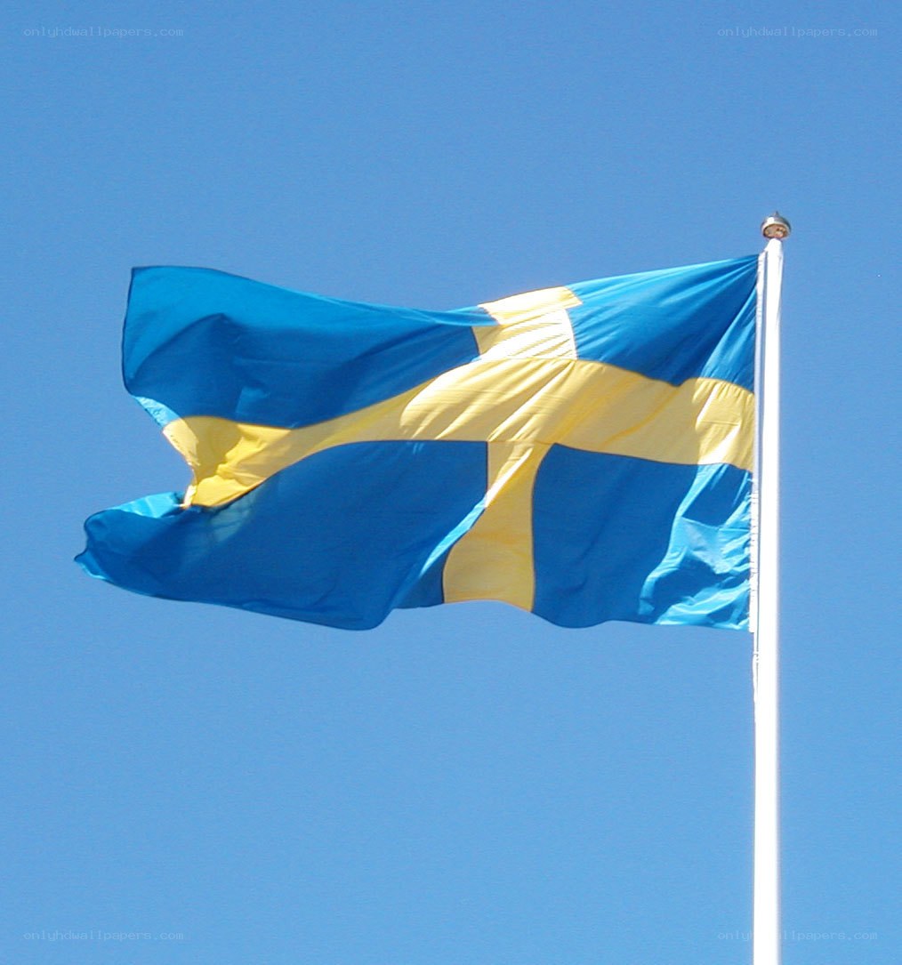 Swedish flag waving in blue sky