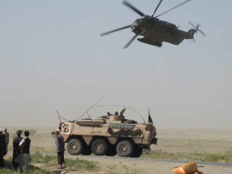 Swedish military vehicle and helicopter