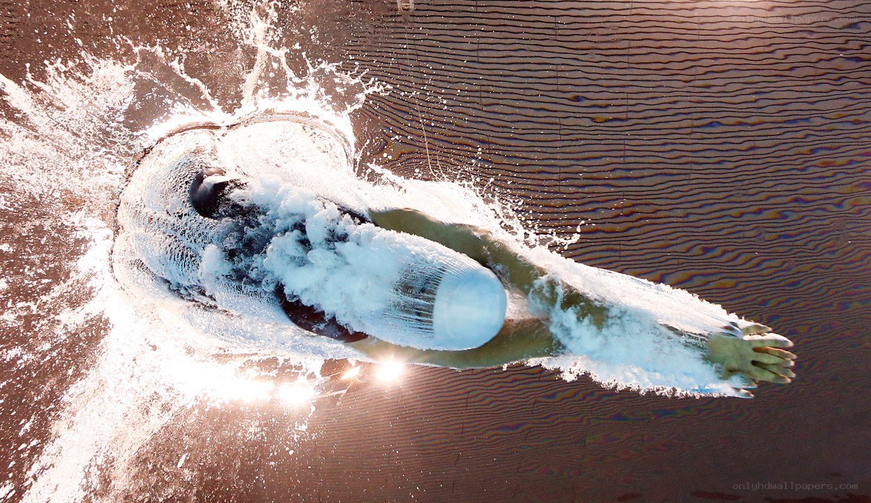 swimmer diving into water