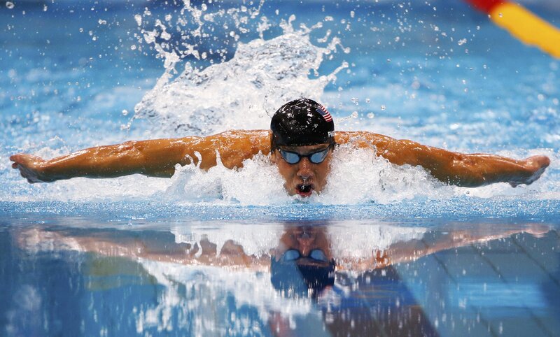 Swimmer Performing Butterfly Stroke — Blue