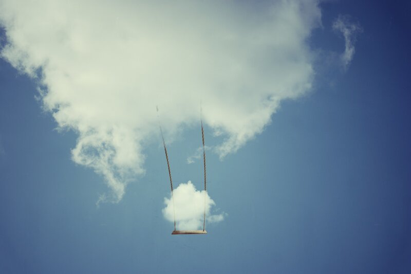 Swing Hanging from Cloud