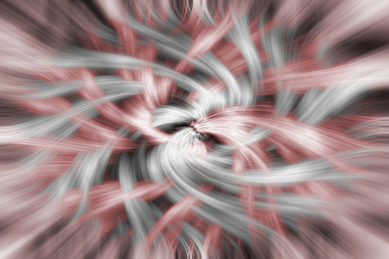 swirling red and white abstract pattern