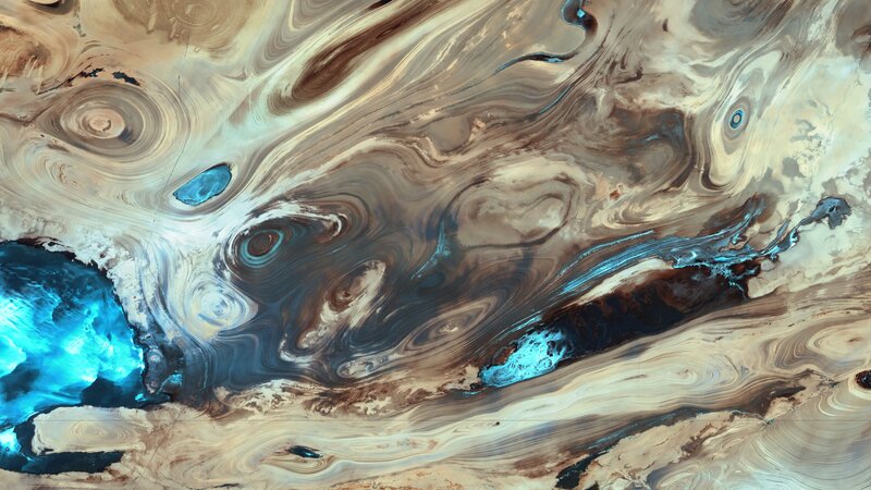 Swirling Sand and Water Patterns