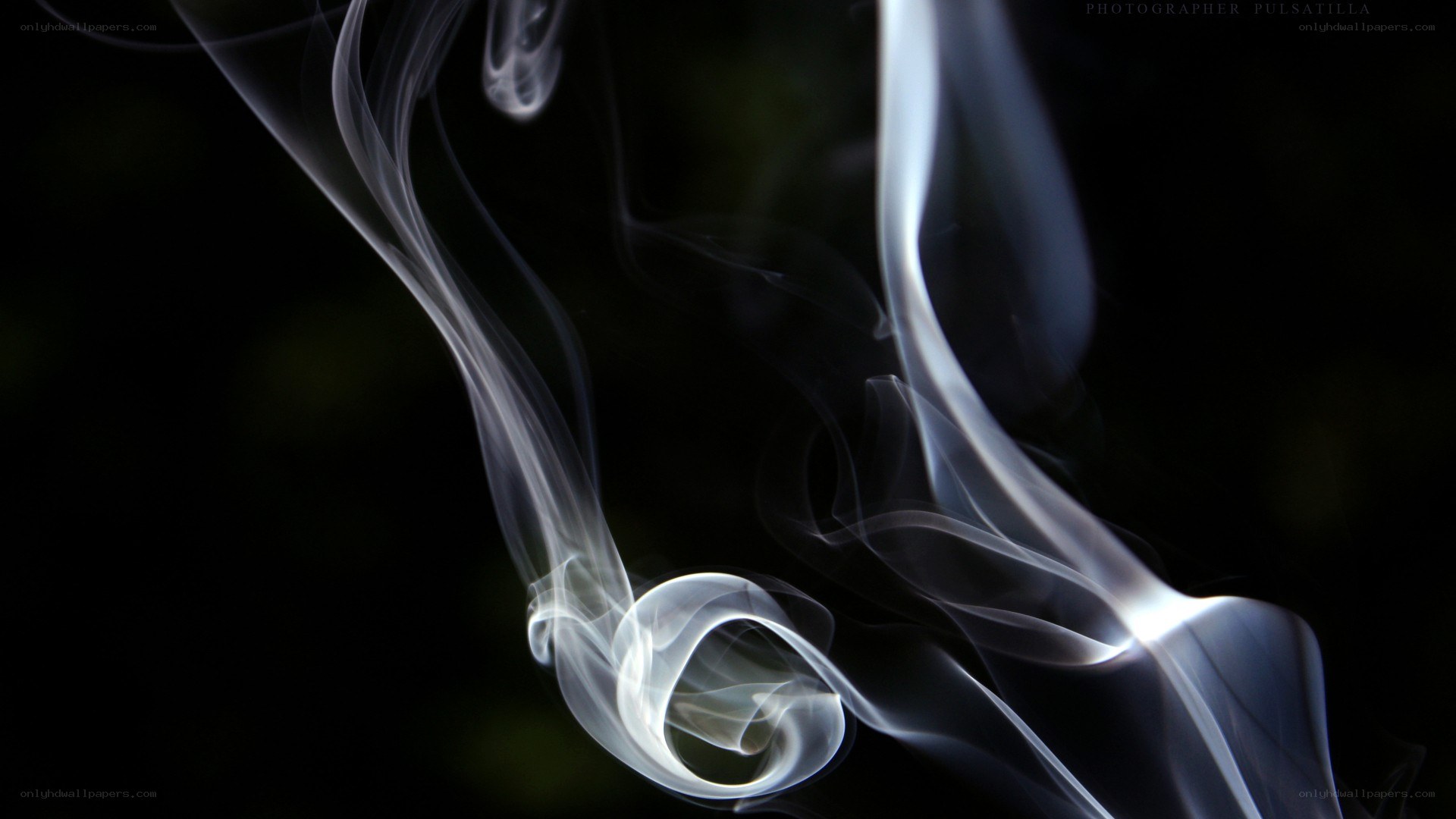 Swirling smoke against black