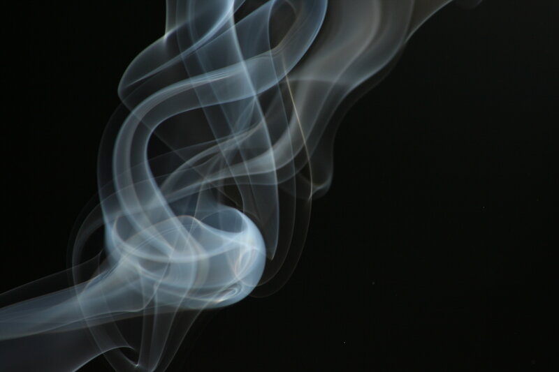 swirling smoke against black