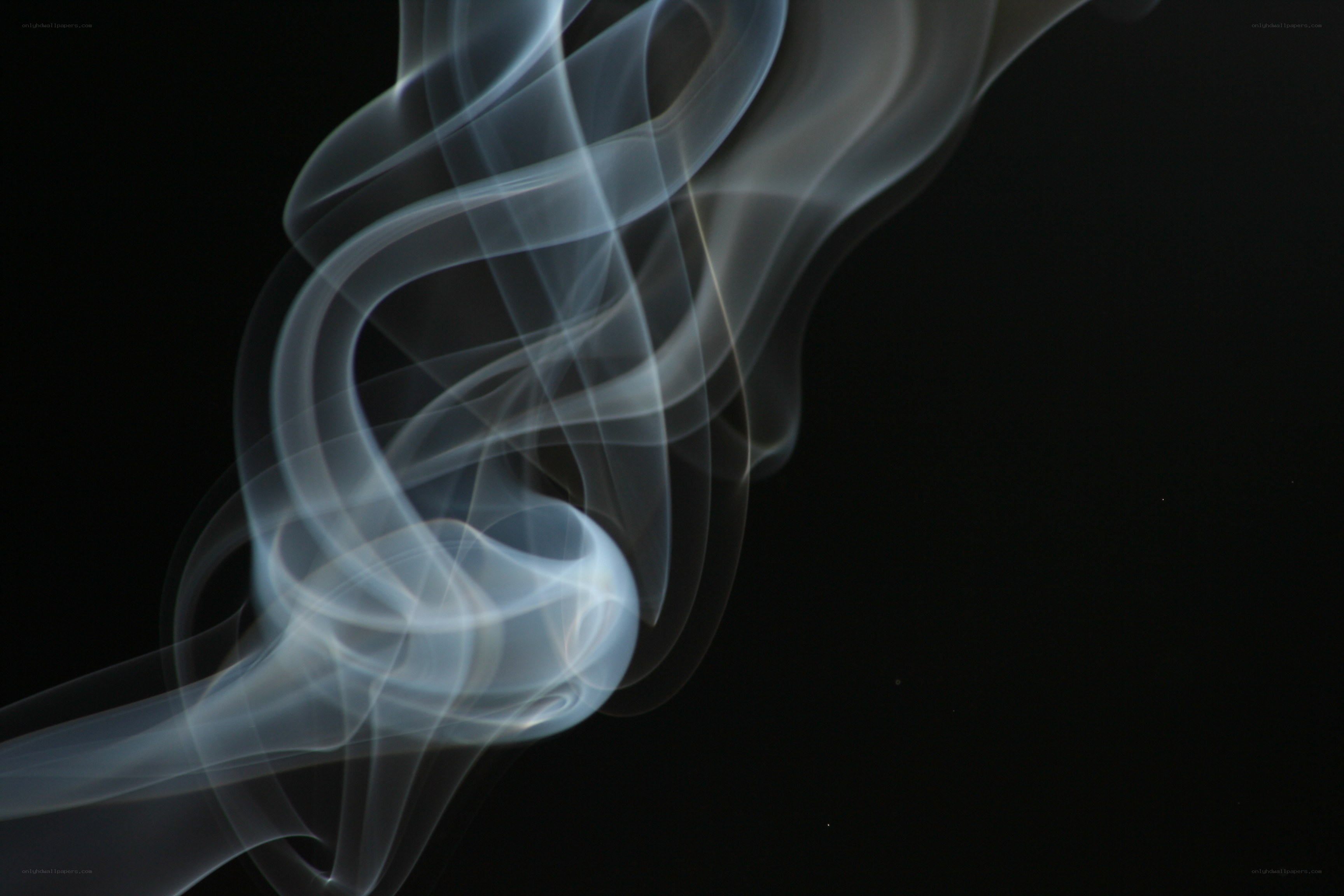 swirling smoke against black