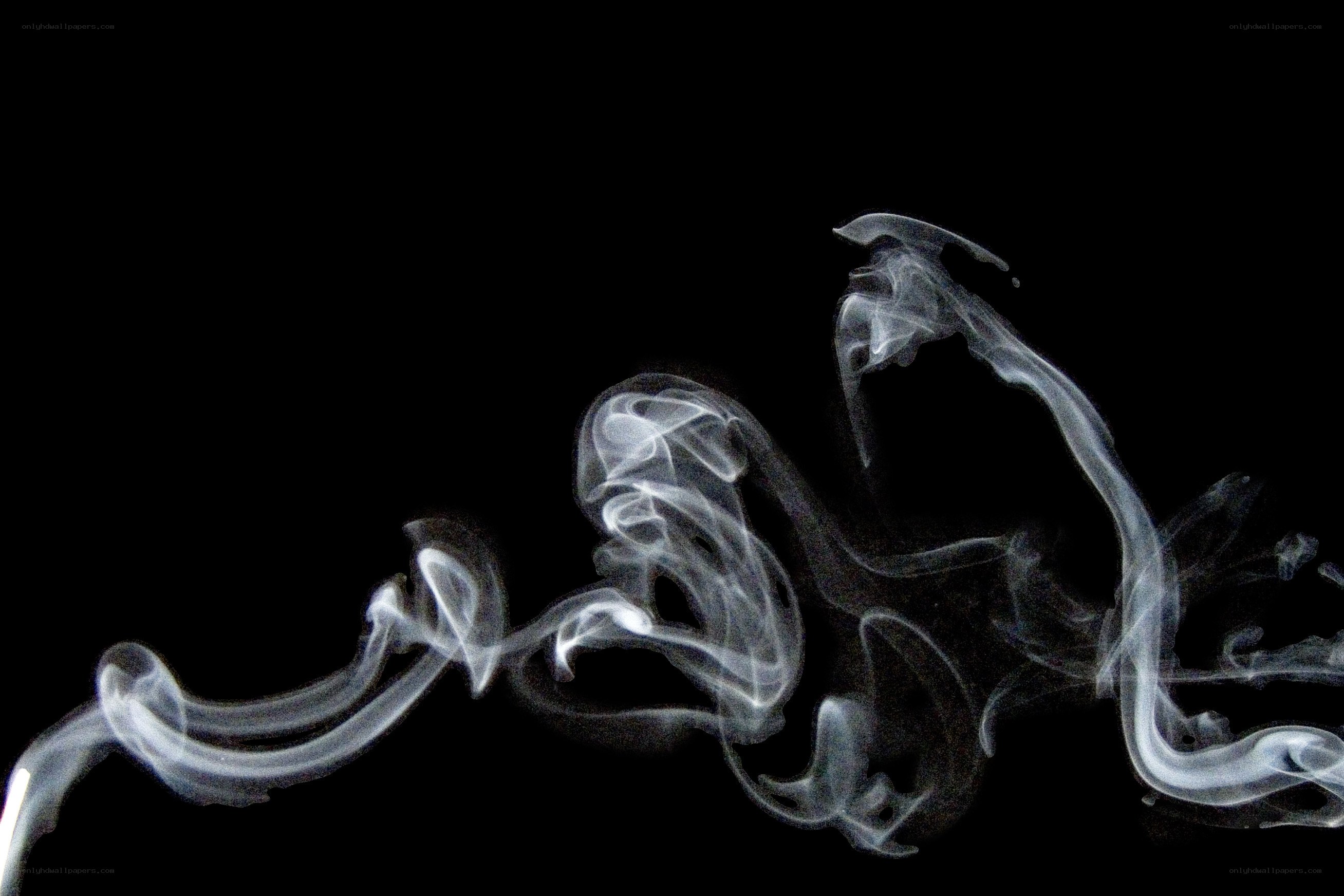 swirling white smoke on black