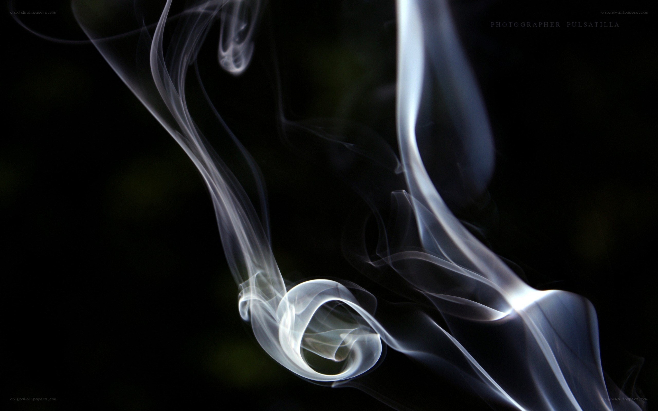 swirling white smoke on black