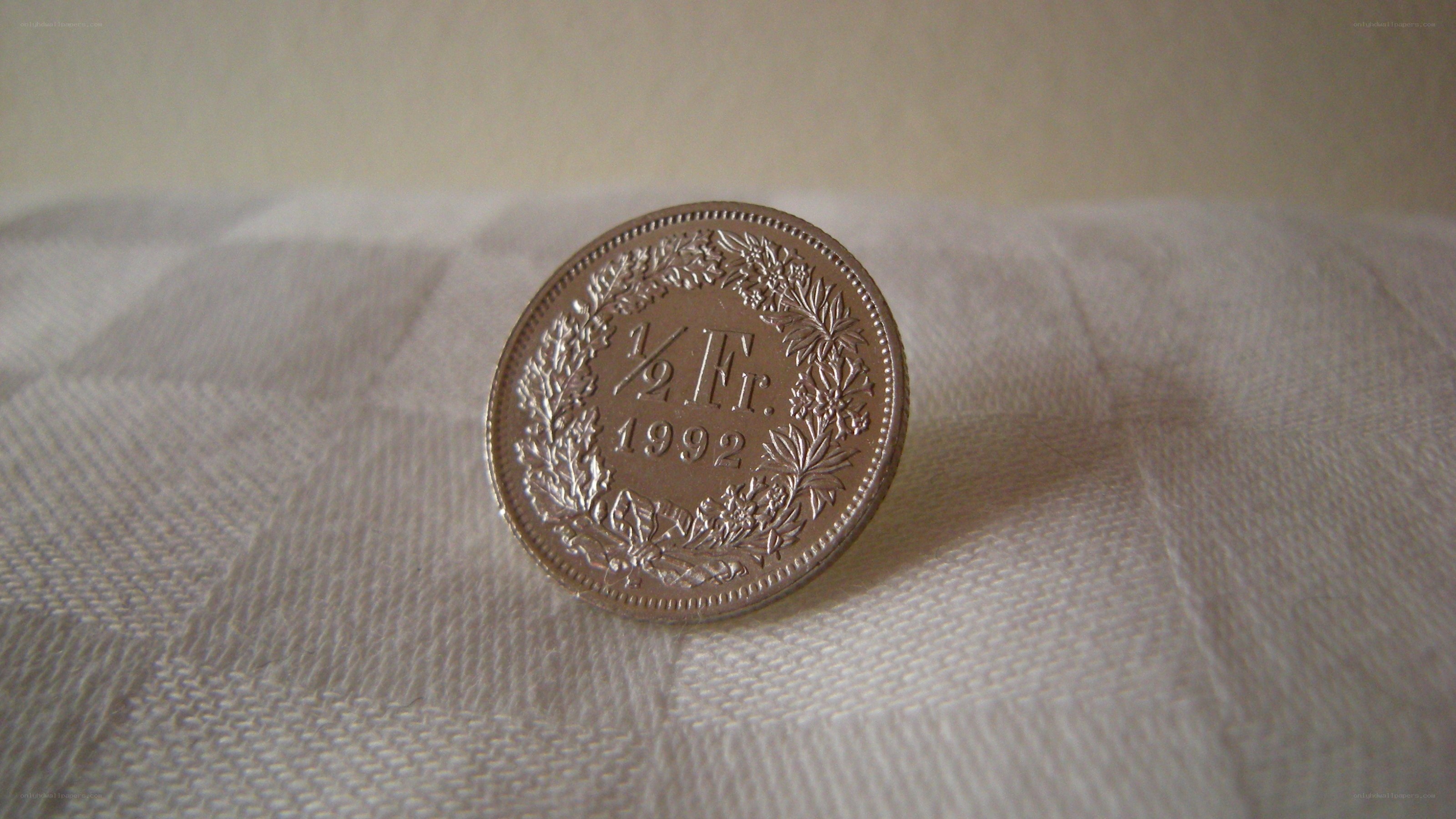 Swiss coin on fabric
