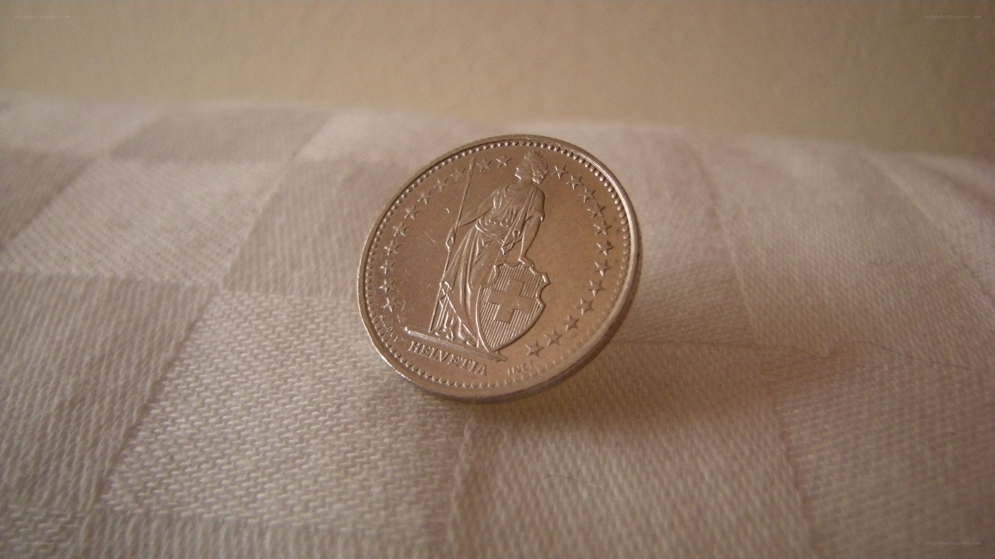 Swiss coin on fabric