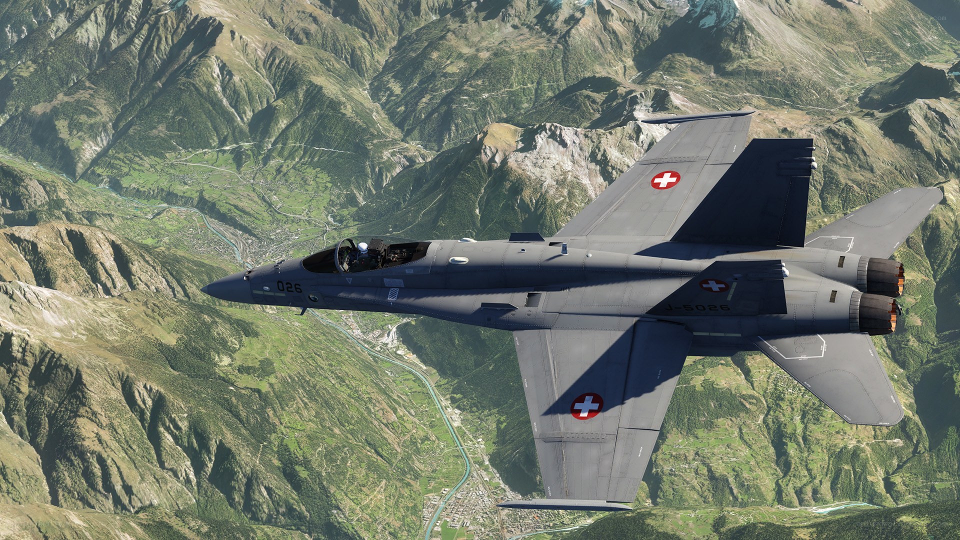 Swiss fighter jet over mountains