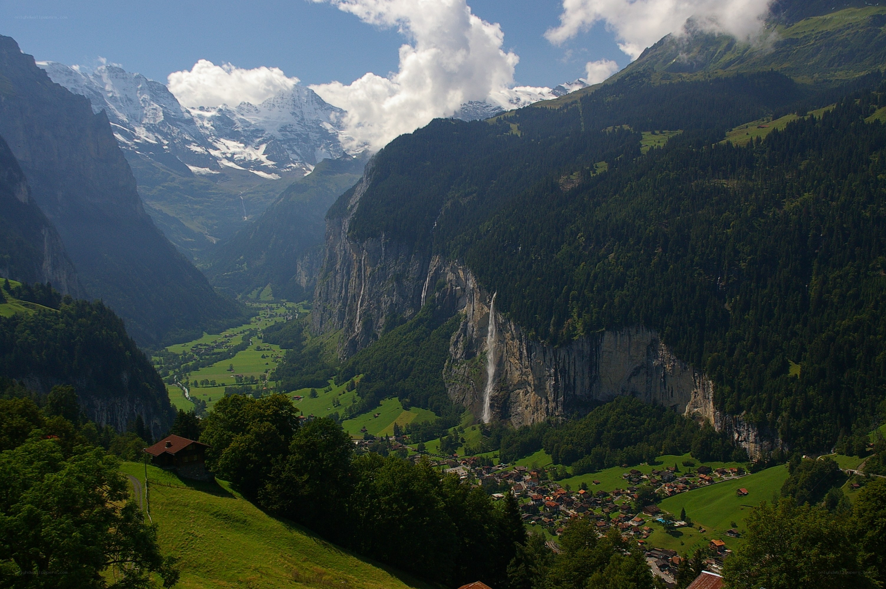 Swiss mountain valley with waterfall