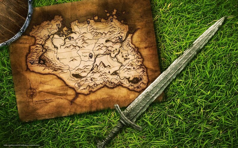 sword and map on grass
