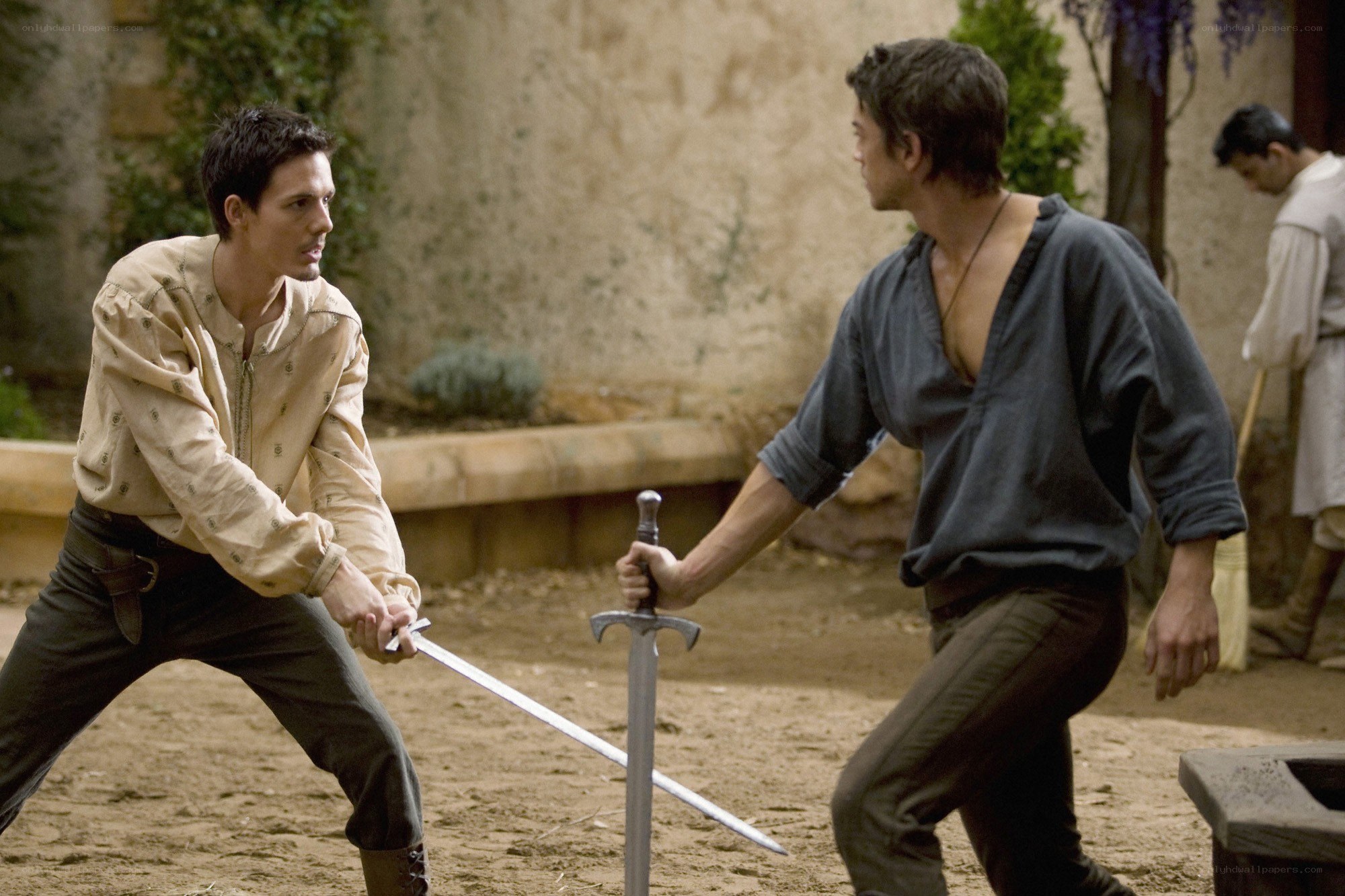 sword fight in courtyard