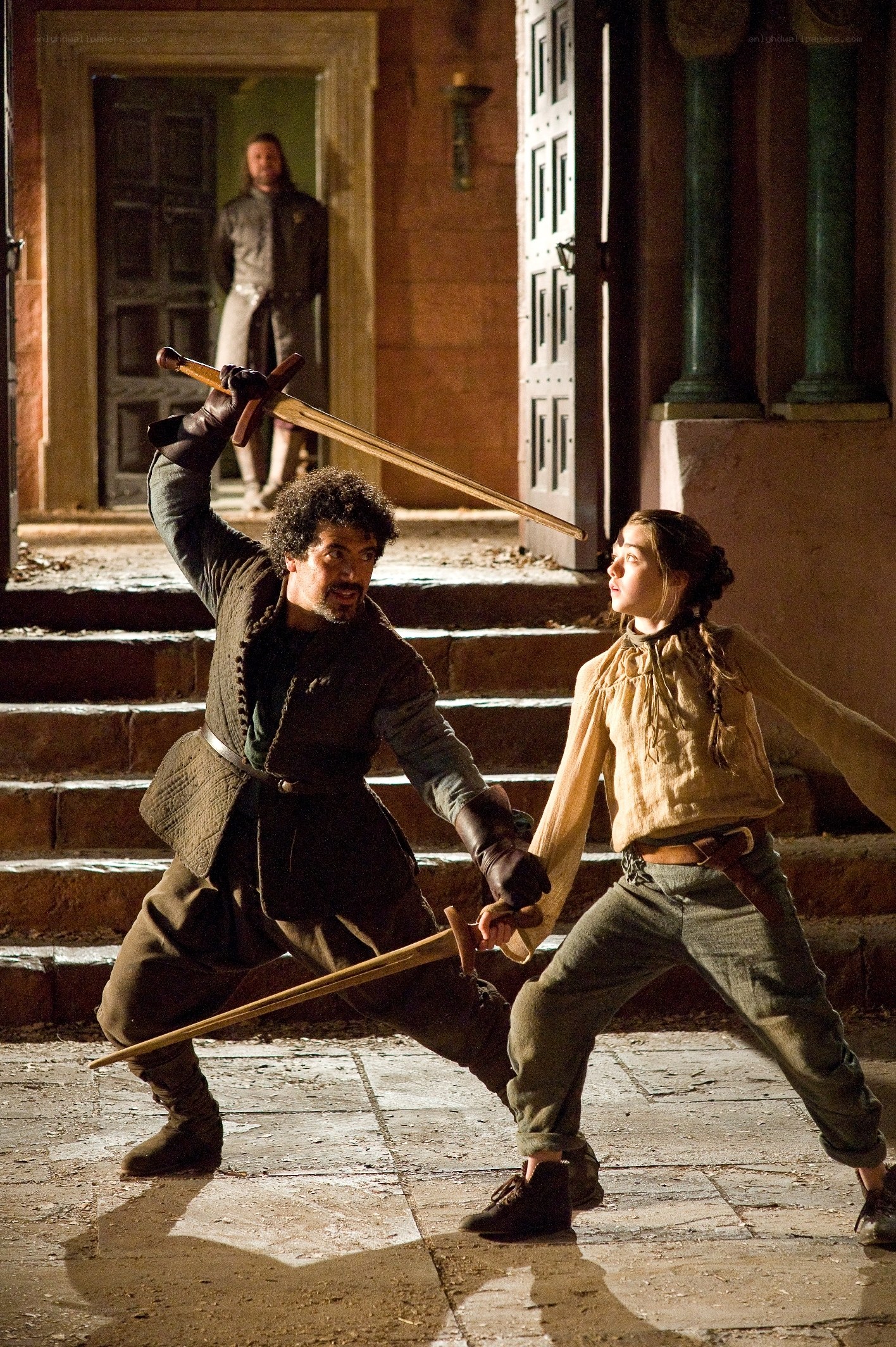 sword fight in courtyard